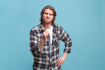 Image showing The overbearing business man point you and want you, half length closeup portrait on pink background.