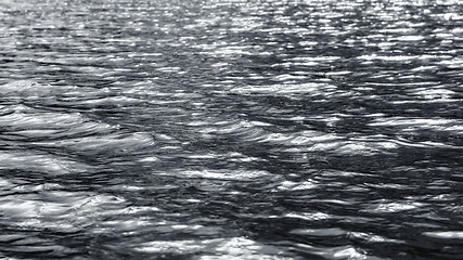 Image showing Dark Monochrome Silvery Flickering Ripples Of Water Surface