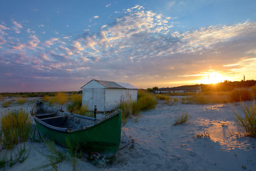 Image showing Old fisherman boat at sunset