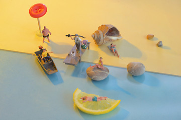 Image showing Miniature people on the beach