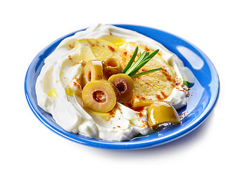 Image showing fresh cream cheese with olives and lemon