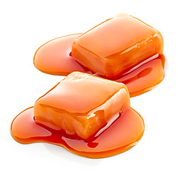 Image showing two pieces of melted caramel candies