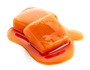 Image showing two pieces of melted caramel