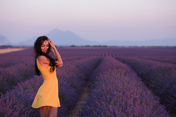 Image showing woman in yellow dress at lavender field