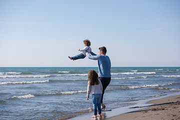 Image showing Young family enjoying vecation during autumn