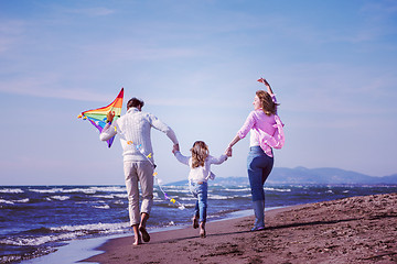 Image showing happy family enjoying vecation during autumn day