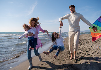 Image showing happy family enjoying vecation during autumn day