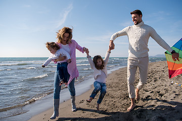 Image showing happy family enjoying vecation during autumn day