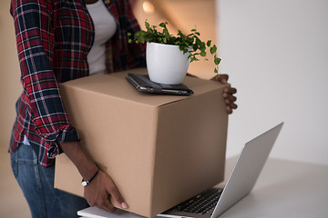 Image showing Black girl moving in the new apartment