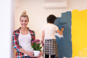 Image showing happy young couple doing home renovations