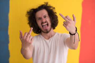 Image showing young man with funny hair over color background