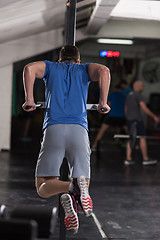 Image showing man doing exercises parallel bars