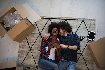 Image showing Top view of attractive young multiethnic couple