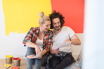 Image showing Happy young couple relaxing after painting