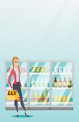 Image showing Woman with pack of beer at supermarket.