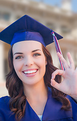 Image showing Happy Graduating Mixed Race Woman In Cap and Gown Celebrating on