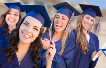 Image showing Happy Graduating Group of Girls In Cap and Gown Celebrating on C