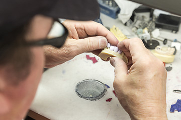 Image showing Dental Technician Working On 3D Printed Mold For Tooth Implants