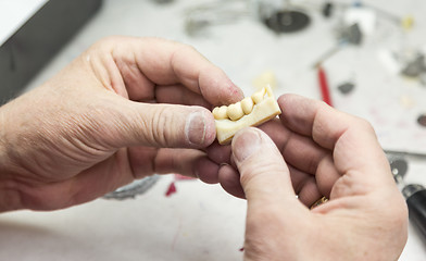 Image showing Dental Technician Working On 3D Printed Mold For Tooth Implants