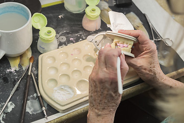 Image showing Dental Technician Applying Porcelain To 3D Printed Implant Mold