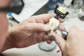 Image showing Dental Technician Working On 3D Printed Mold For Tooth Implants