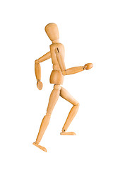 Image showing Wooden mannequin running upstairs