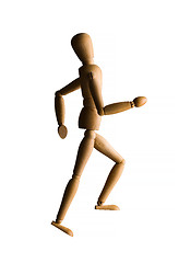 Image showing Wooden mannequin running upstairs