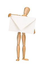 Image showing Wooden model dummy holding envelop