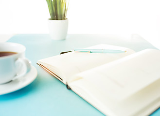 Image showing Books and pen on the blue table