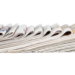 Image showing Assortment of folded newspapers