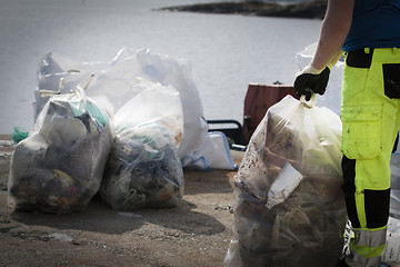 Image showing Picking up Plastic Waste