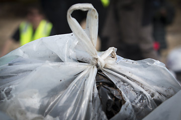 Image showing Picking up Plastic Waste