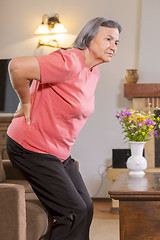 Image showing Senior woman suffering from backache at home