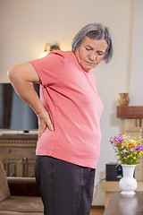 Image showing Senior woman suffering from backache at home