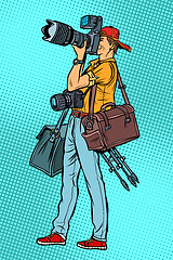 Image showing Professional photographer with camera and equipment