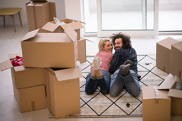 Image showing Young couple moving in a new flat