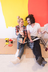 Image showing Happy young couple relaxing after painting