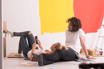 Image showing Happy young couple relaxing after painting