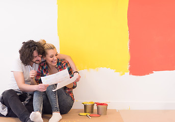 Image showing Happy young couple relaxing after painting