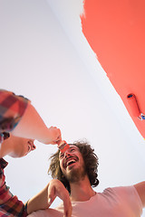 Image showing couple painting interior wall