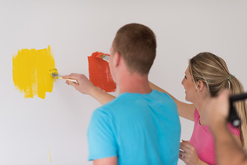 Image showing couple painting interior wall