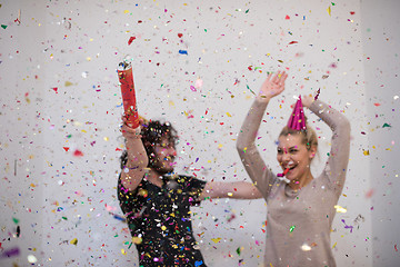 Image showing romantic young  couple celebrating  party with confetti