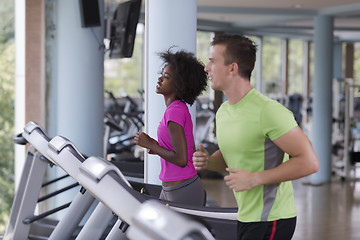 Image showing people exercisinng a cardio on treadmill