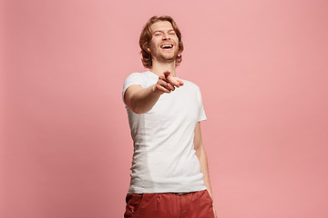 Image showing The happy business man point you and want you, half length closeup portrait on pink background.