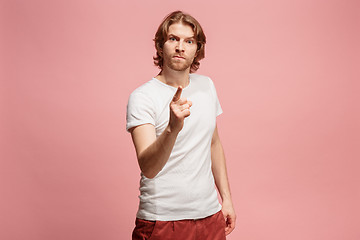 Image showing The overbearing business man point you and want you, half length closeup portrait on pink background.