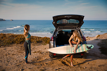 Image showing Surf and friendship Getting ready for another surf day