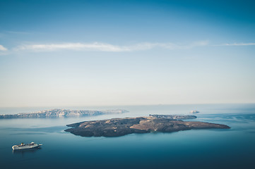 Image showing Beautiful landscape with sea view. Cruise liner at the sea near the Nea Kameni, a small Greek island in the Aegean Sea near Santorini