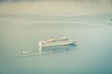 Image showing Cruise liner at the sea near the Nea Kameni, a small Greek island in the Aegean Sea near Santorini