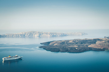 Image showing Beautiful landscape with sea view. Cruise liner at the sea near the Nea Kameni, a small Greek island in the Aegean Sea near Santorini