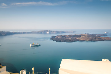 Image showing Beautiful landscape with sea view. Cruise liner at the sea near the Nea Kameni, a small Greek island in the Aegean Sea near Santorini